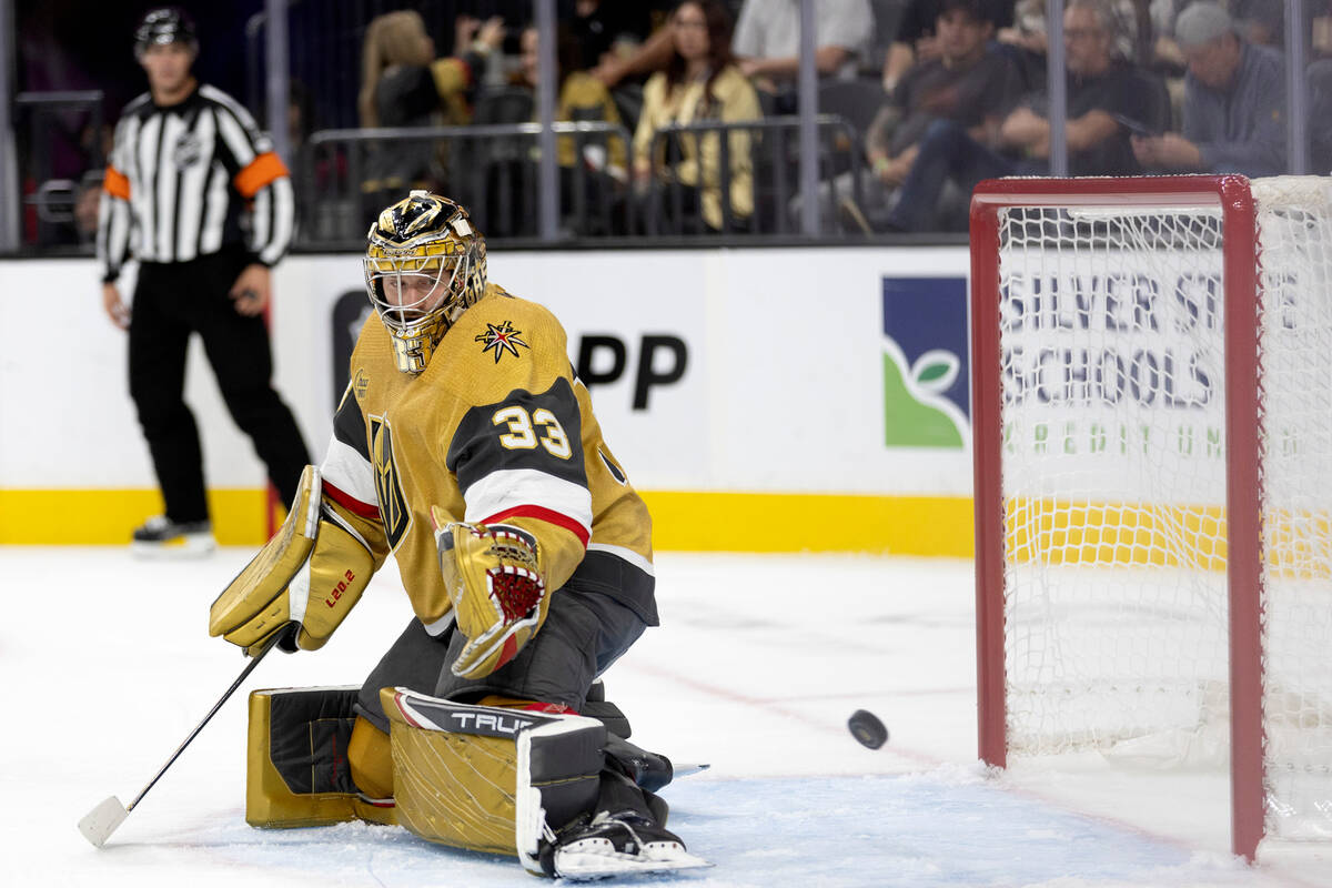 Golden Knights goaltender Adin Hill (33) makes a save against the Jets during the second period ...