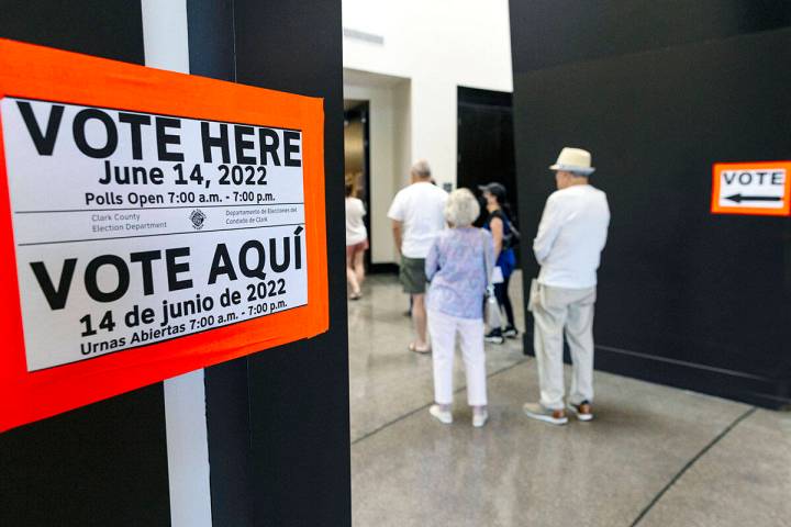 Voters line up to cast their ballots at Sahara West Library on Tuesday, June 14, 2022, in Las V ...
