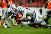 Denver Broncos quarterback Russell Wilson (3) is sacked by Indianapolis Colts safety Rodney McL ...