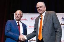 Gov. Steve Sisolak, right, and Sheriff Joseph Lombardo shake hands after meeting with the const ...