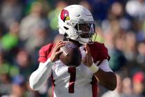 Arizona Cardinals quarterback Kyler Murray (1) looks to pass during the first half of an NFL fo ...