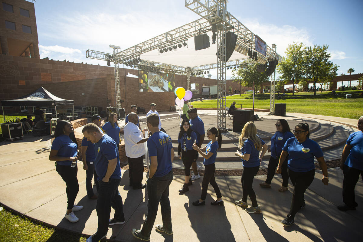 Palms employees, representing Palms Cares, arrive to donate $50,000 to non-profit Green Our Pla ...