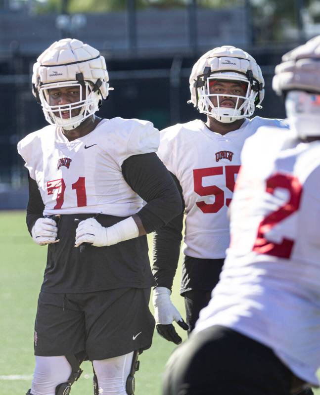 UNLV offensive linemen Daviyon McDaniel (71) and Preston Nichols (55) look on during football p ...