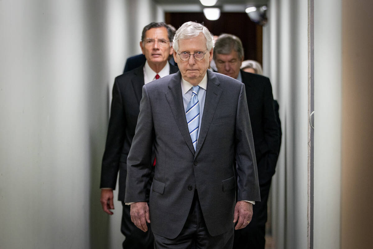 Senate Minority Leader Mitch McConnell, of Ky., arrives to speak to reporters Sept. 7, 2022, ah ...
