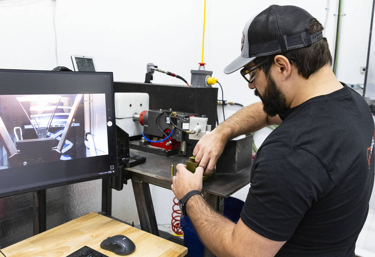 Nick Groat, founder and CEO of Safe Life Defense, prepares to shoot an M855 5.56mm bullet into ...