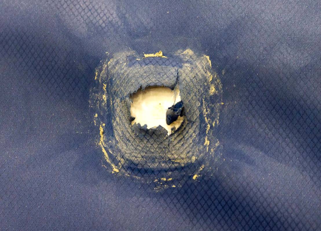 A hole caused by an M855 5.56mm bullet on the Safe Life Defense's Flexible Rifle Armor System ( ...