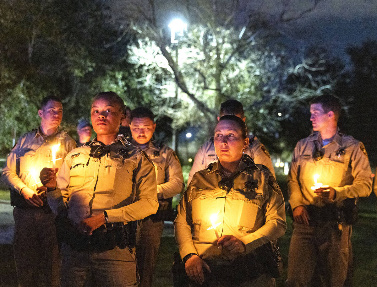 Las Vegas police officers gathered during a candlelight vigil for fallen officer Truong Thai, o ...