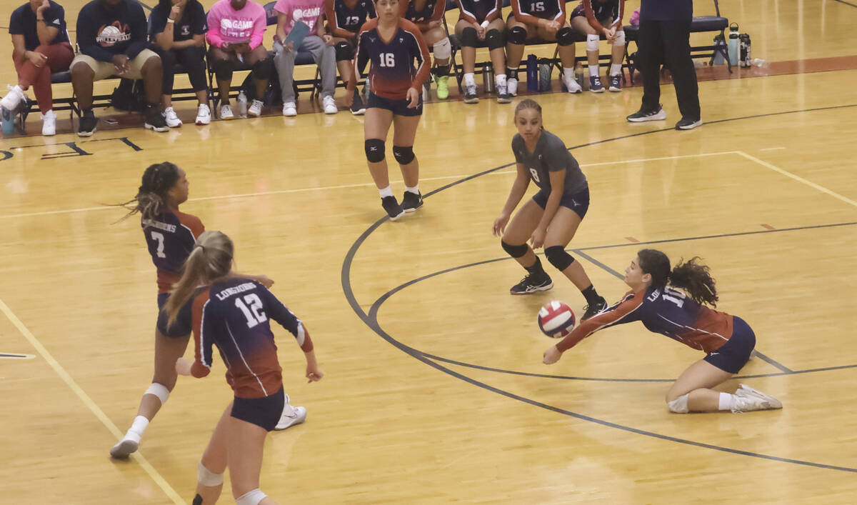 Legacy's Jocelyn Taveras (10) slides to get to the ball during a volleyball game against Libert ...