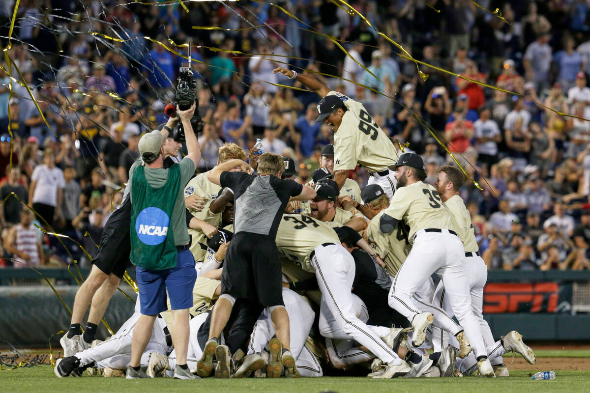 Vanderbilt players celebrate winning Game 3 of the NCAA College World Series baseball finals ag ...