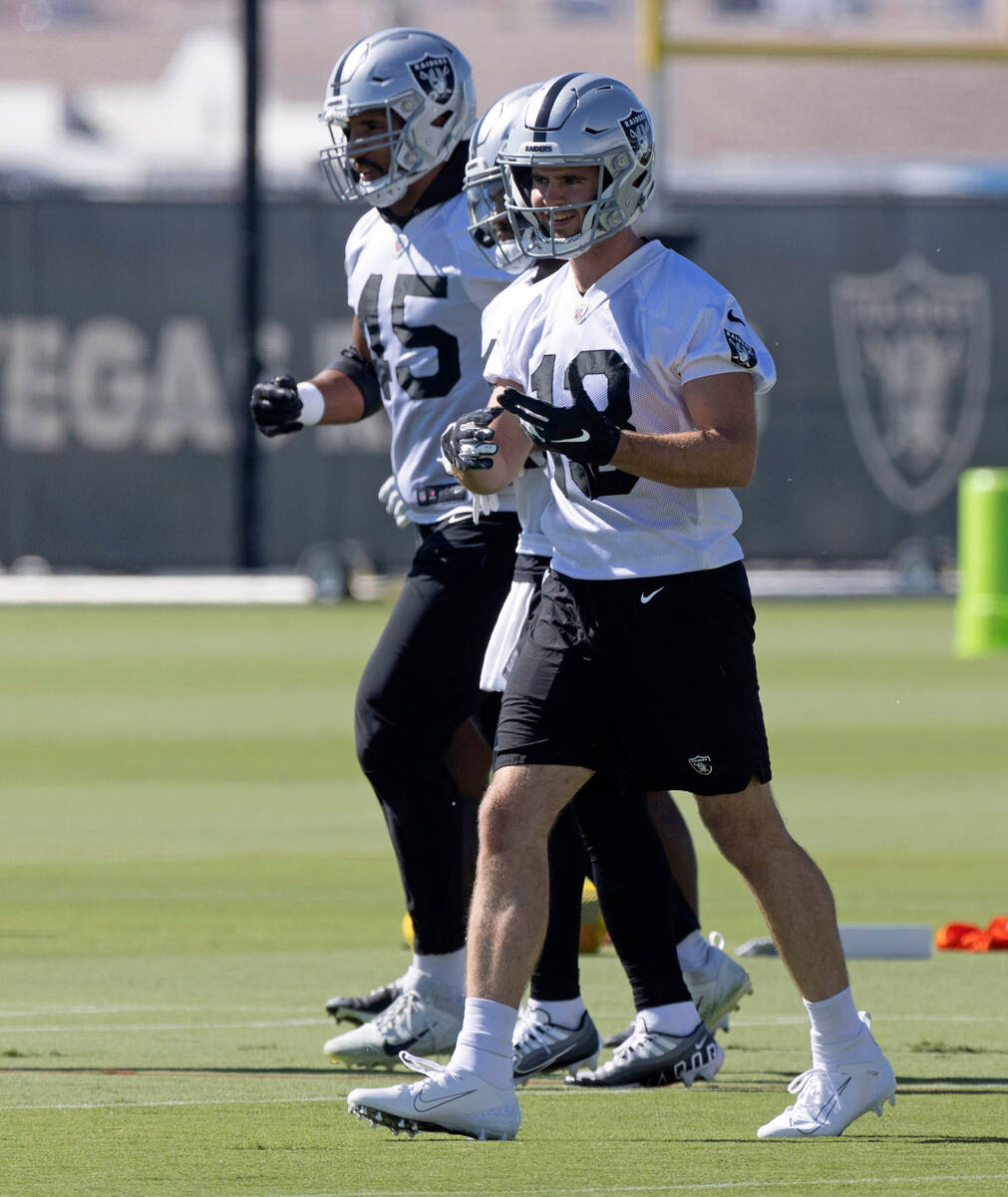 Raiders wide receiver Hunter Renfrow (13) smiles as he prepares to work a drill during practice ...