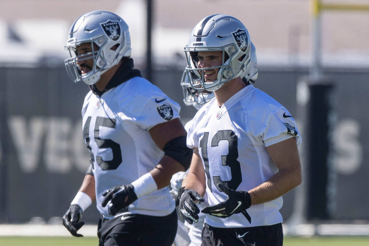 Raiders wide receiver Hunter Renfrow (13) smiles as he prepares to work a drill during practice ...