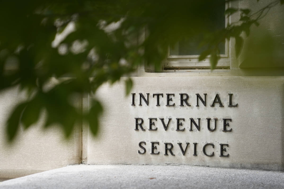 A sign is displayed outside the Internal Revenue Service building May 4, 2021, in Washington. T ...