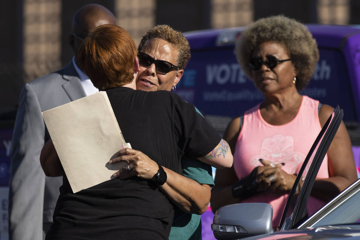 Nevada State Sen. Pat Spearman, center, takes a moment to embrace family, friends, and supporte ...