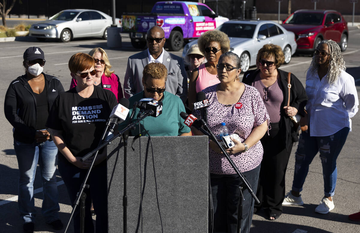 Nevada State Sen. Pat Spearman, center, surrounded by friends, family and supporters, holds a p ...