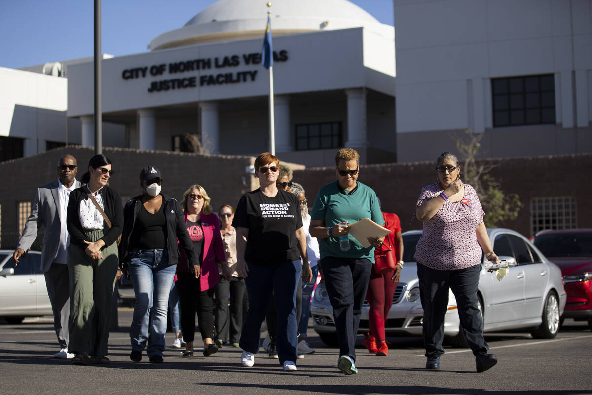 Nevada State Sen. Pat Spearman, second from right, walks to a podium while surrounded by friend ...