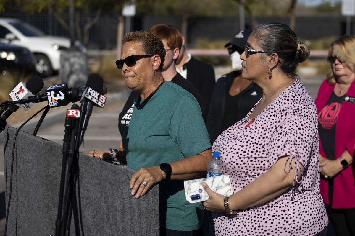 Nevada State Sen. Pat Spearman, left, surrounded by friends, family and supporters, holds a pre ...