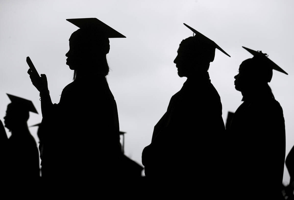 FILE - New graduates line up before the start of a community college commencement in East Ruthe ...