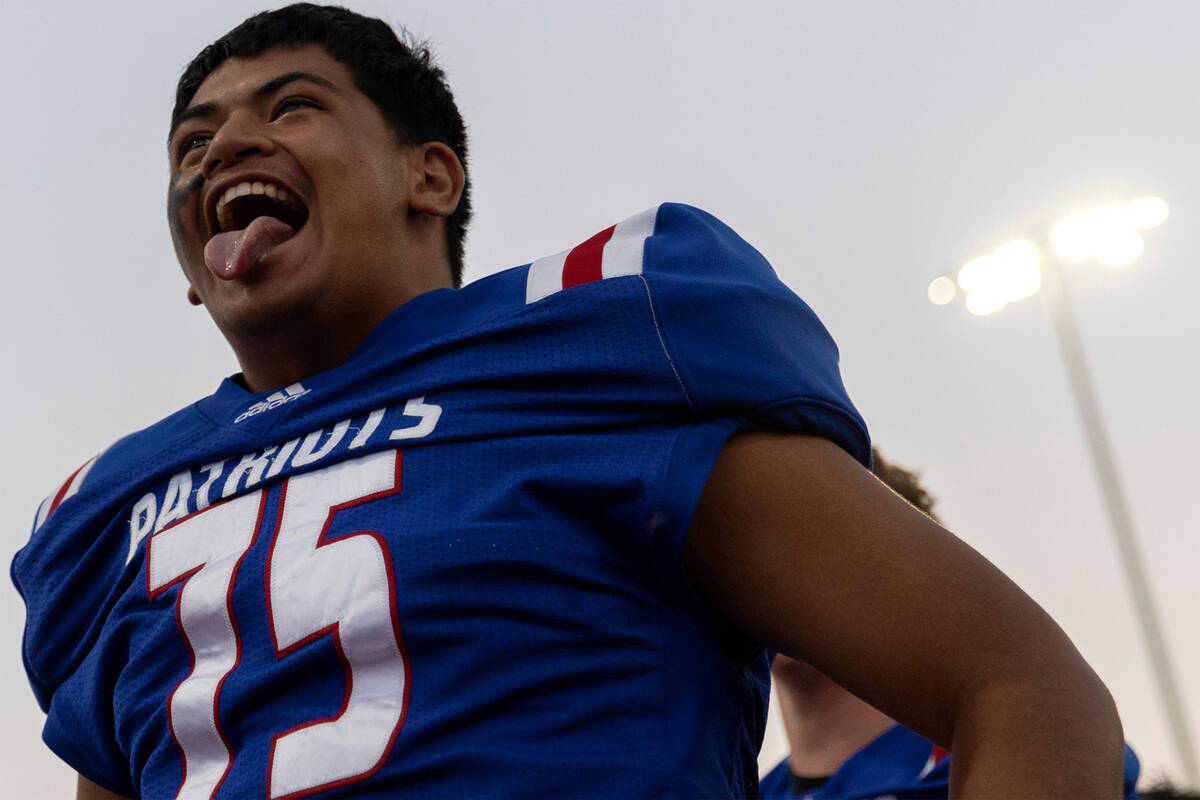 Liberty’s Jacob Maiava pumps up the crowd before a Class 5A high school football game ag ...
