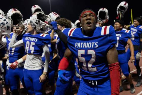 Liberty’s Jeremiah Ioane (52) and his team celebrate after winning a Class 5A high schoo ...