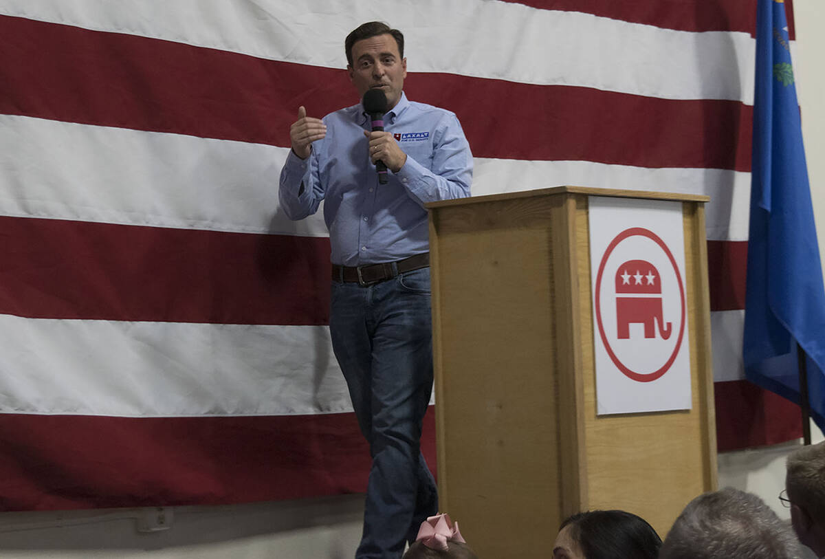 Adam Laxalt, Republican candidate for U.S. senator, speaks to a rally in South Reno on Saturday ...