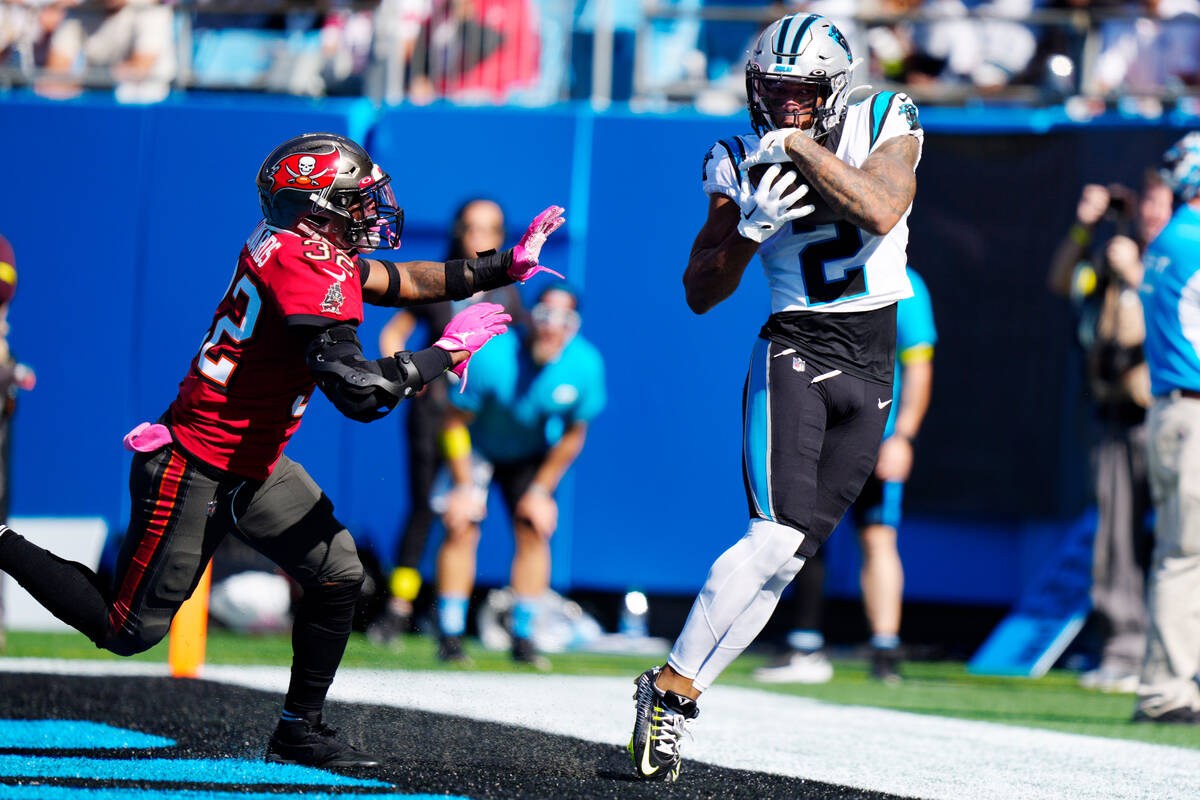 Carolina Panthers wide receiver DJ Moore (2) hauls in a touchdown pass in front of Tampa Bay Bu ...