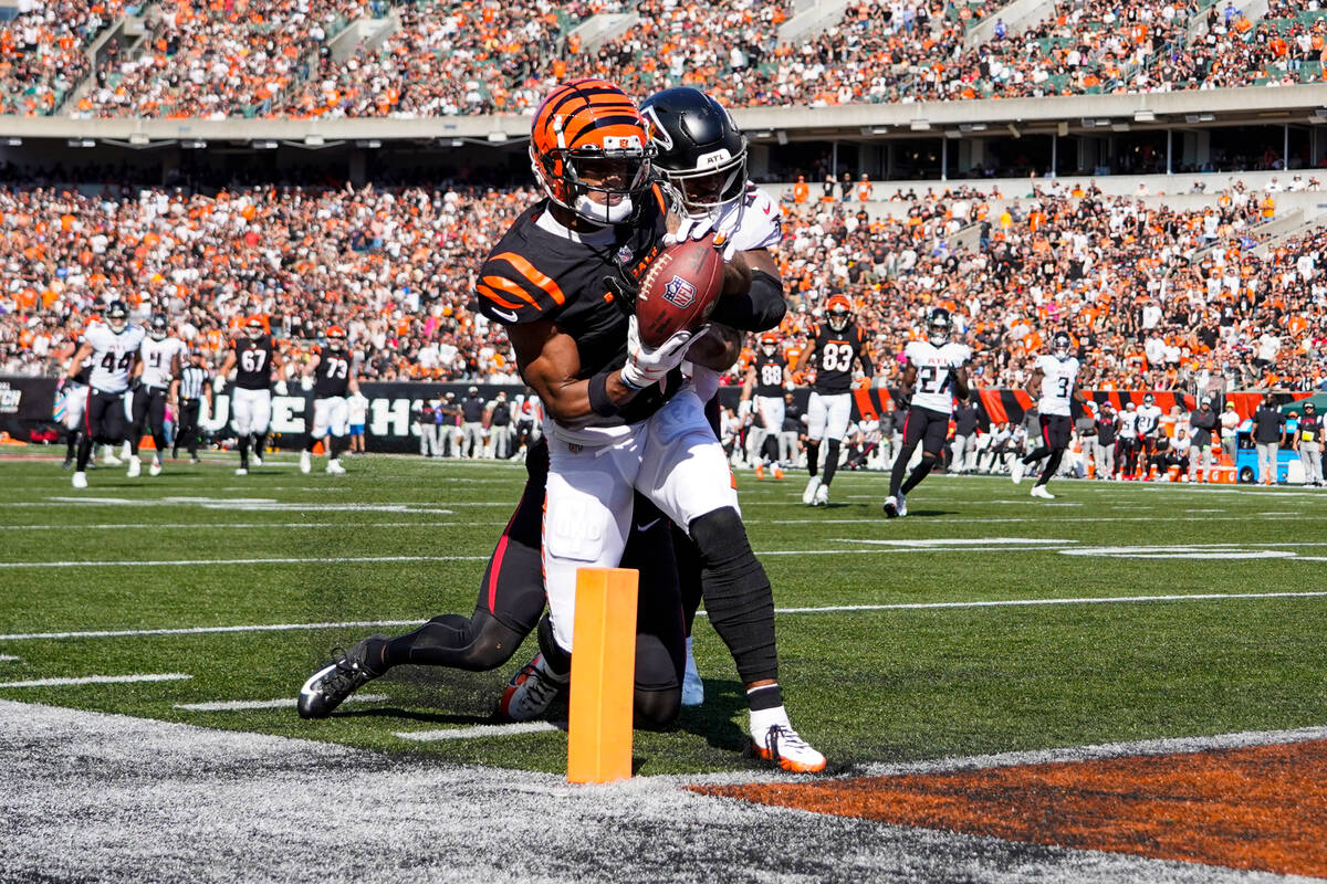 Cincinnati Bengals wide receiver Ja'Marr Chase (1) makes a catch for a touchdown in front of At ...
