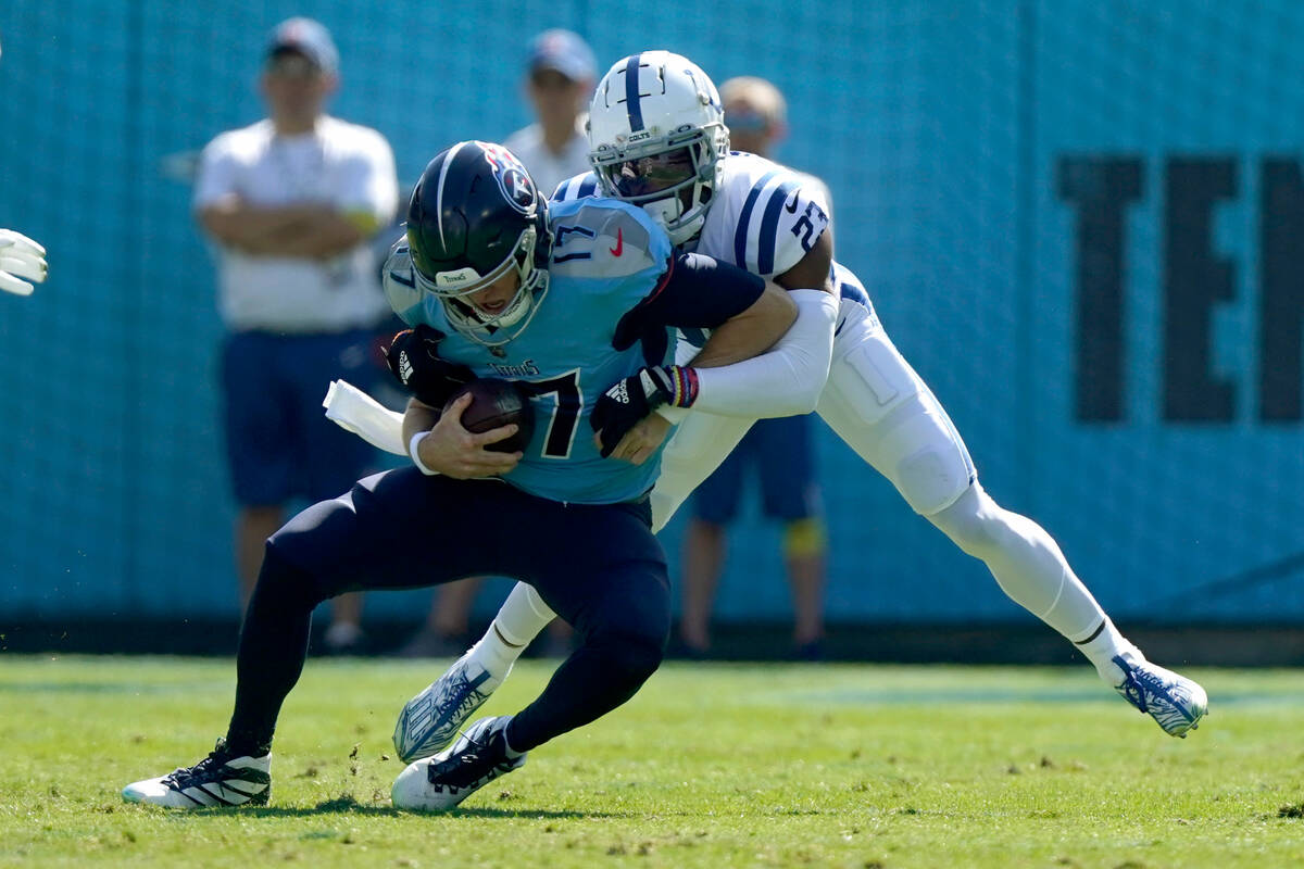 Tennessee Titans quarterback Ryan Tannehill (17) is sacked by Indianapolis Colts cornerback Ken ...