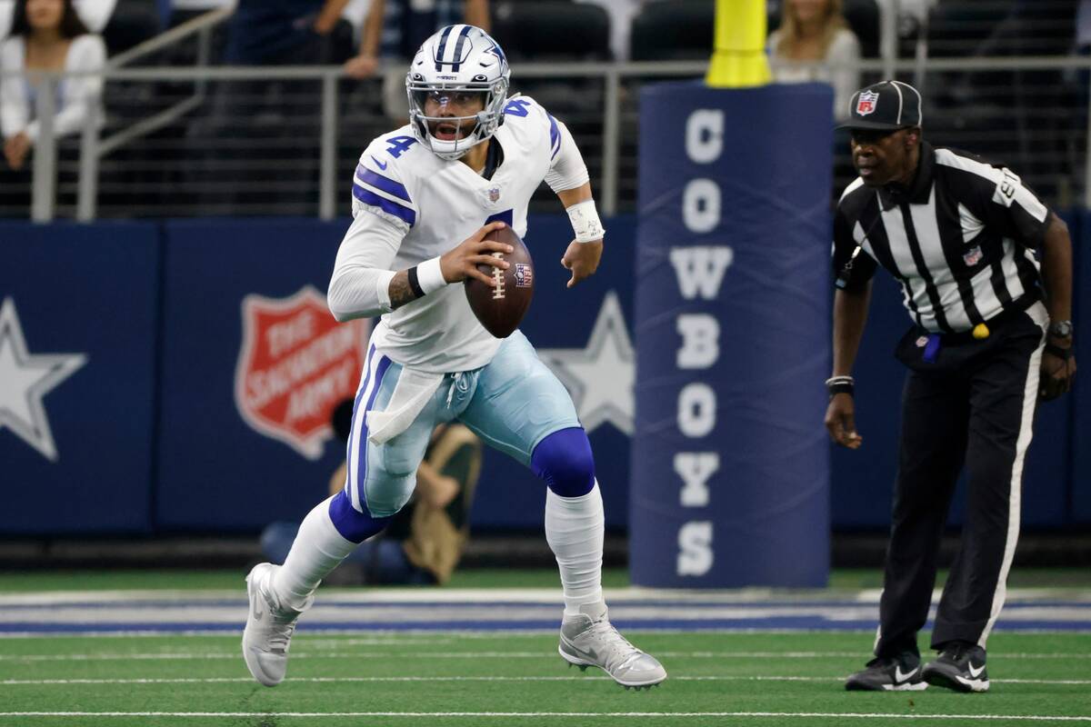 Dallas Cowboys quarterback Dak Prescott looks downfield during the first half of an NFL footbal ...