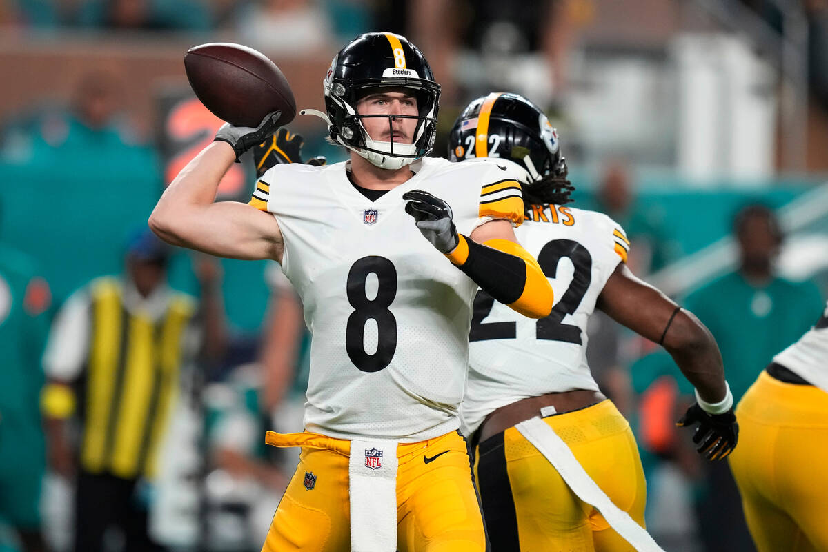 Pittsburgh Steelers quarterback Kenny Pickett (8) aims a pass during the first half of an NFL f ...