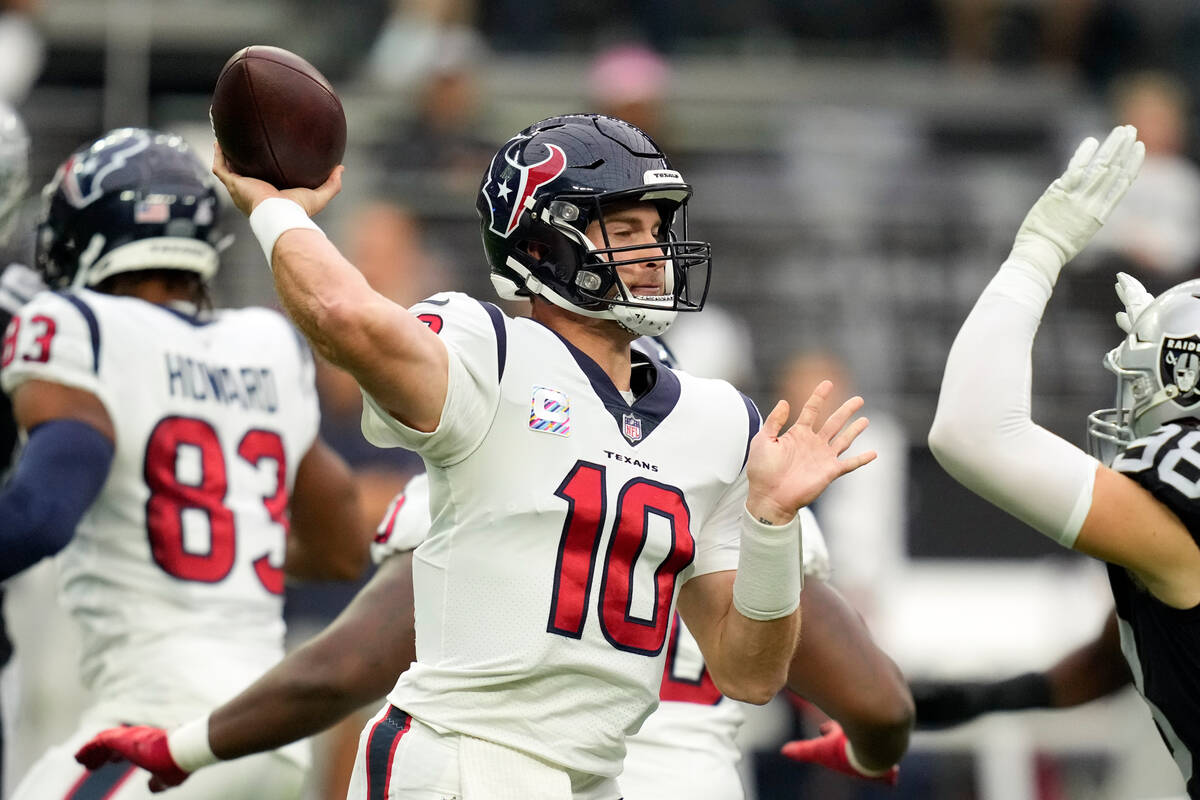 Houston Texans quarterback Davis Mills throws a pass during the first half of an NFL football g ...