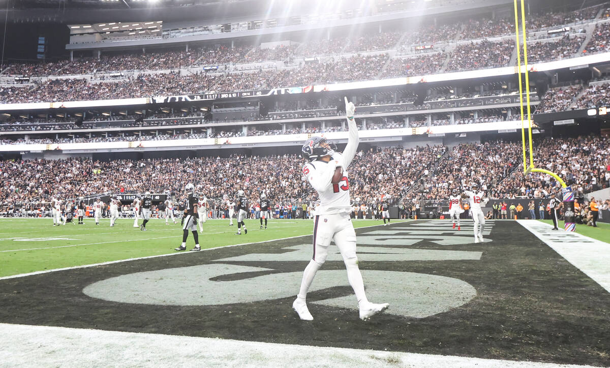 Houston Texans wide receiver Chris Moore (15) celebrates his touchdown against the Raiders duri ...