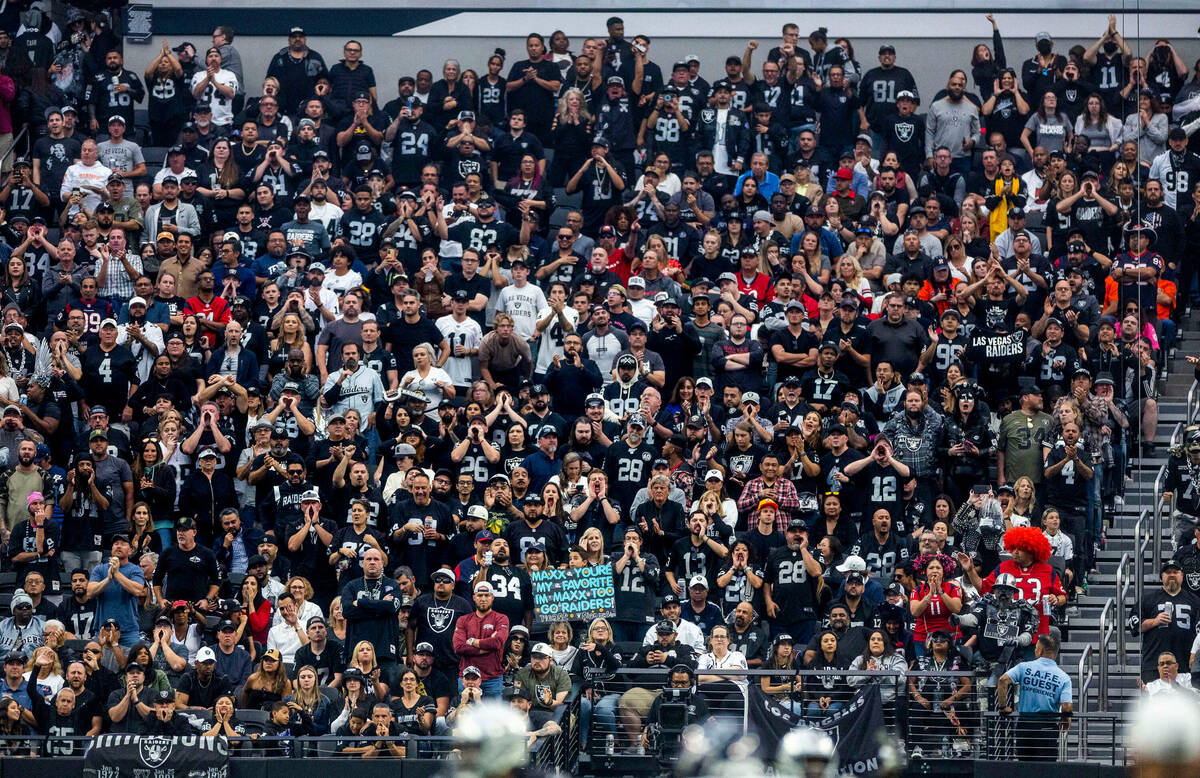 Raiders fans celebrate another score score versus the Houston Texans during the second half of ...