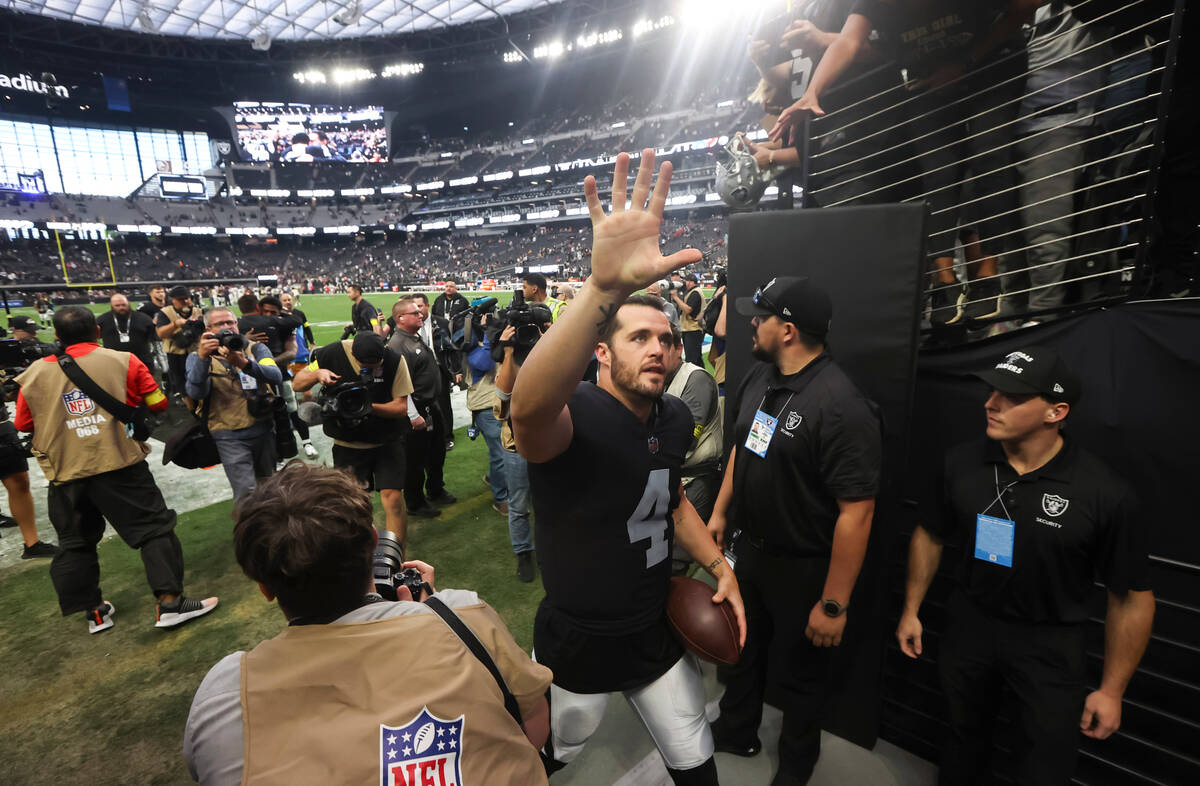 Raiders quarterback Derek Carr (4) acknowledges fans after defeating the Houston Texans during ...