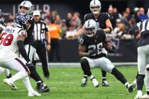 Raiders running back Josh Jacobs (28) runs the ball against the Houston Texans during the first ...