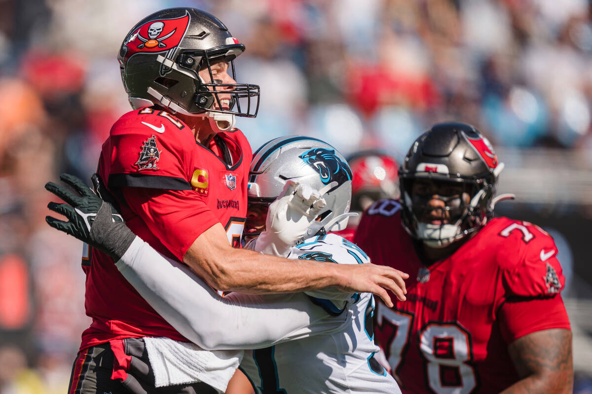 Carolina Panthers defensive end Yetur Gross-Matos, right, pressures Tampa Bay Buccaneers quarte ...