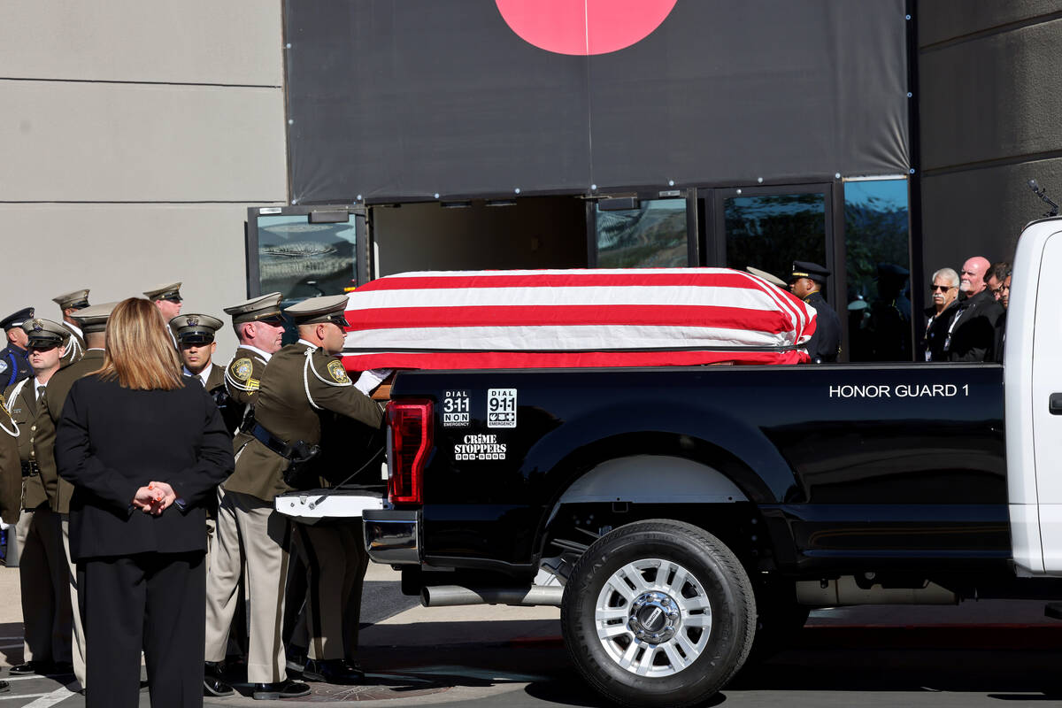 Honor guard members load the casket for fallen Las Vegas police officer Truong Thai during a fu ...