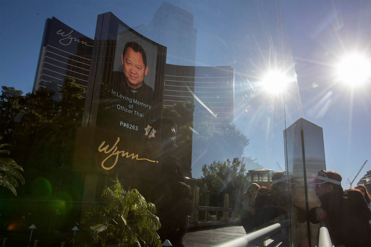 Wynn displays a memorial message for the late officer Truong Thai as a procession for the Las V ...