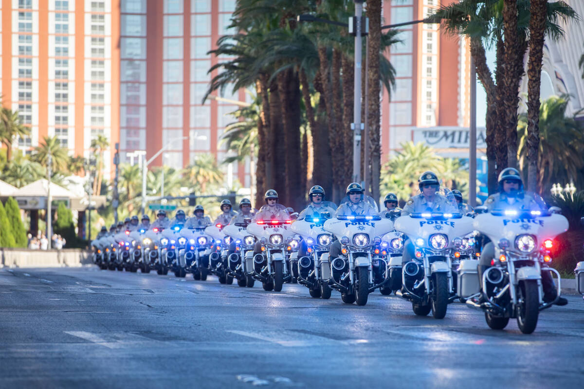 A funeral procession is held on the Strip in honor of officer Truong Thai on Friday, Oct. 28, 2 ...