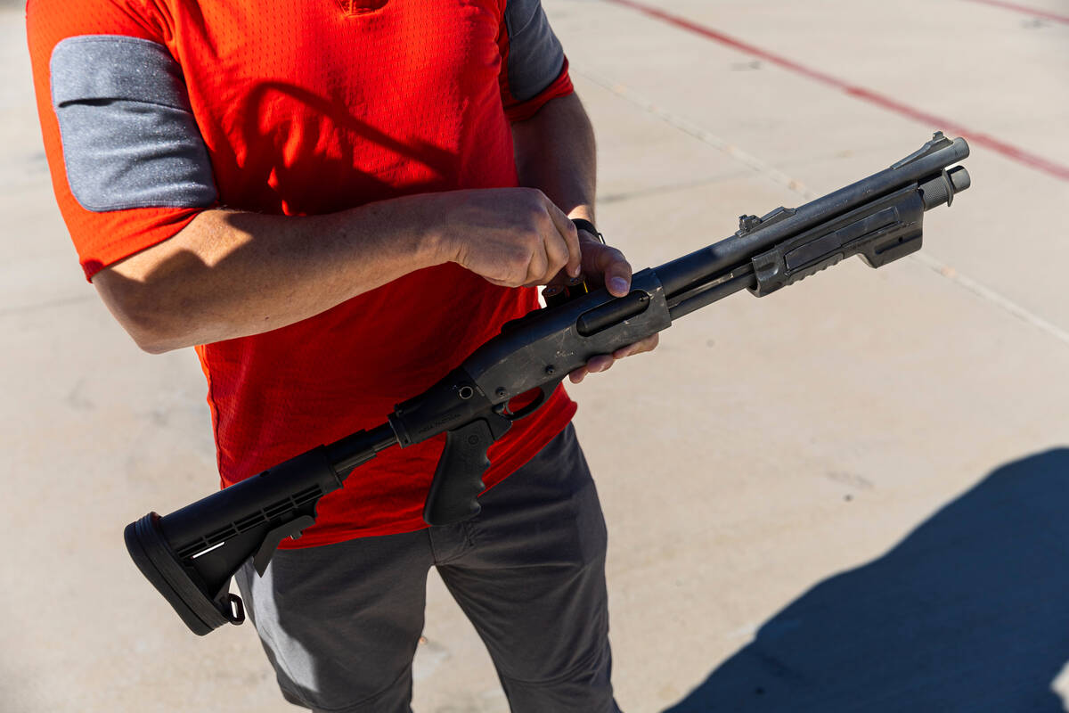 An FBI firearms instructor/special agent loads a Remington 870 shotgun during a range day held ...