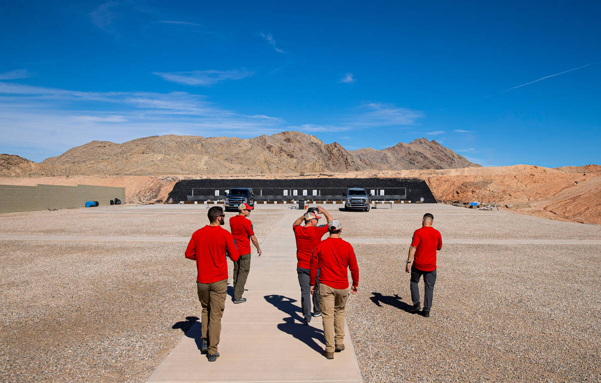 FBI special agents/firearms instructors walk to a gun range held by the FBI at the Joint Tactic ...