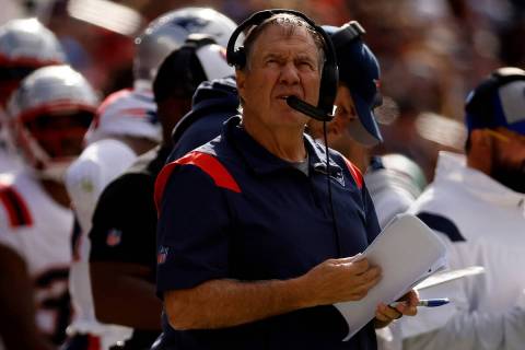 New England Patriots head coach Bill Belichick stands on the sideline during an NFL football ga ...