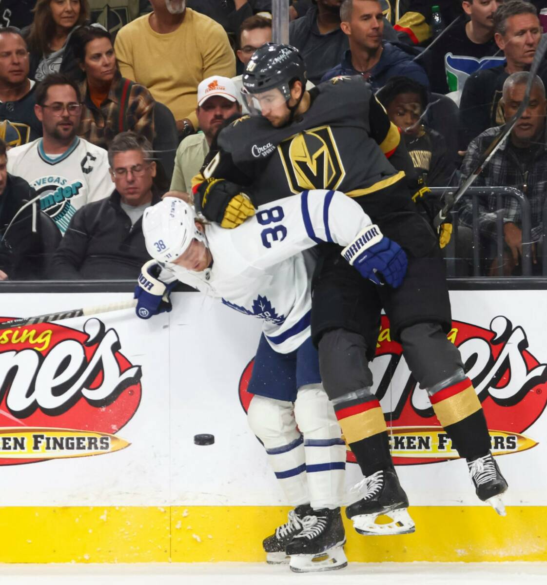 Toronto Maple Leafs defenseman Rasmus Sandin (38) and Golden Knights center Nicolas Roy (10) vi ...
