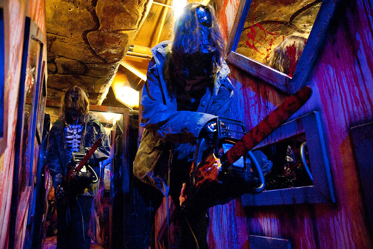 Actors in character participate in a run-through for zombies, monsters and demonic clowns at th ...