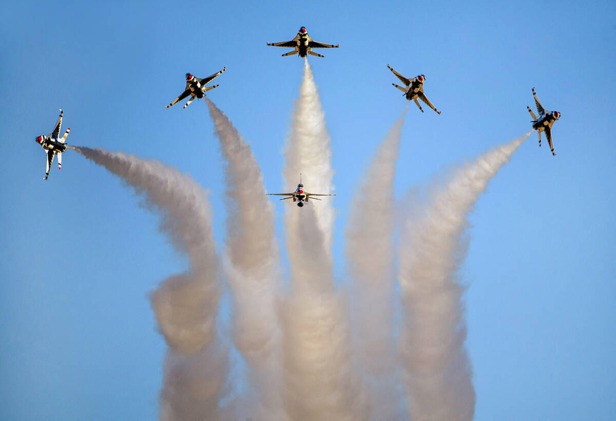 All six U.S. Air Force Thunderbirds break away from formation in various directions during the ...