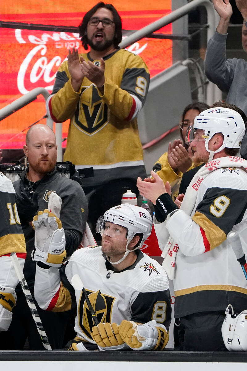 Vegas Golden Knights center Phil Kessel (8) waves to the crowd while being congratulated for pl ...