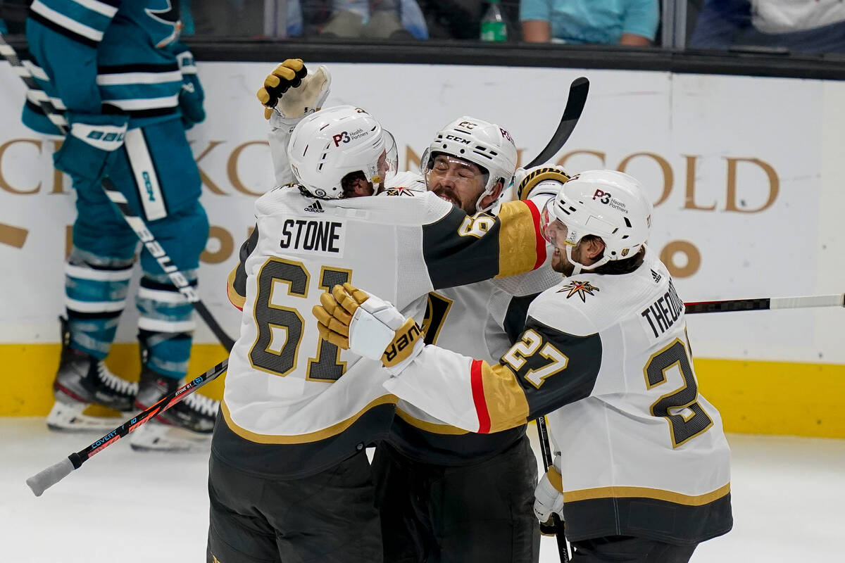 Vegas Golden Knights right wing Mark Stone (61) celebrates with center Chandler Stephenson (20) ...