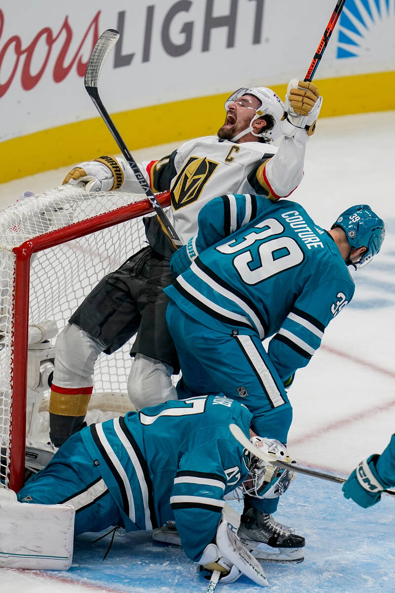 Vegas Golden Knights right wing Mark Stone, top, reacts afters scoring against San Jose Sharks ...