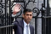 British Prime Minister Rishi Sunak waves from the steps after delivering a speech at 10 Downing ...