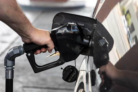 David Newman of Las Vegas pumps gas at Terrible’s on Torrey Pines Drive on Monday, March ...