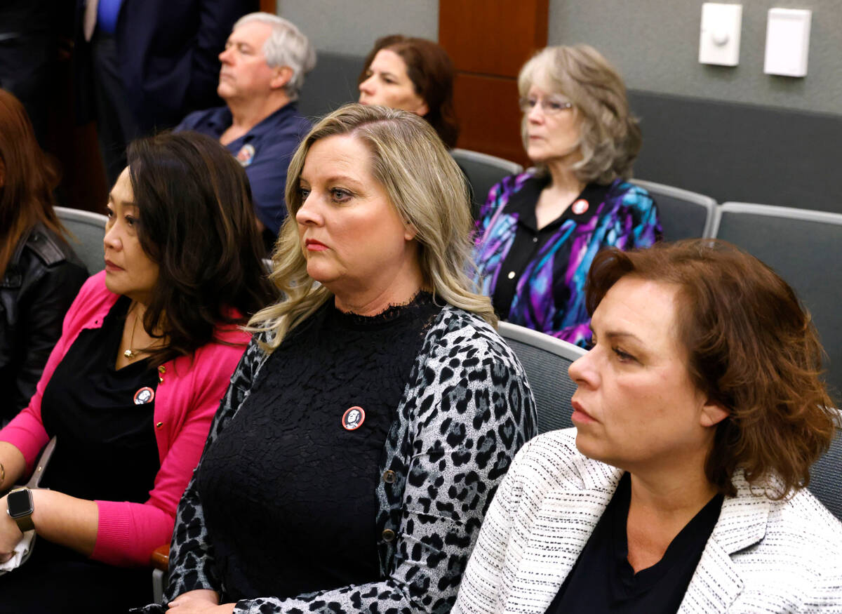 Clark County public administrator Robert Telles' former coworkers Noraine Pagdanganan, front le ...